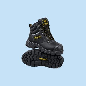 Pair of black Safety Boy work boots showing padded collar, heavy-duty lacing system, and treaded rubber sole.